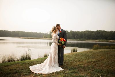 Bride and groom sharing a quiet moment together beside a North Texas lake